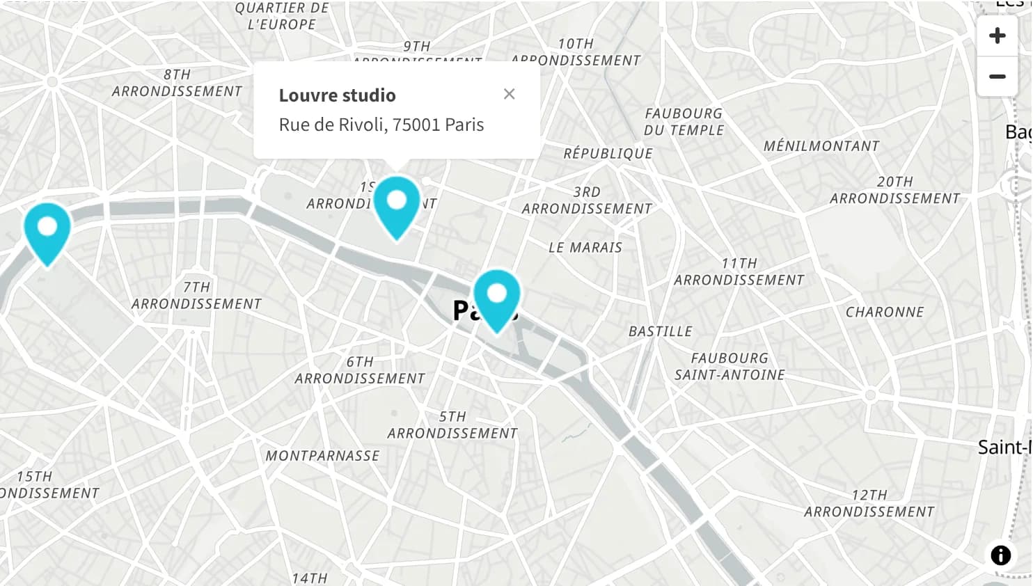 A Light style OpenStreetMap map of Paris with four custom markers and an open location popup